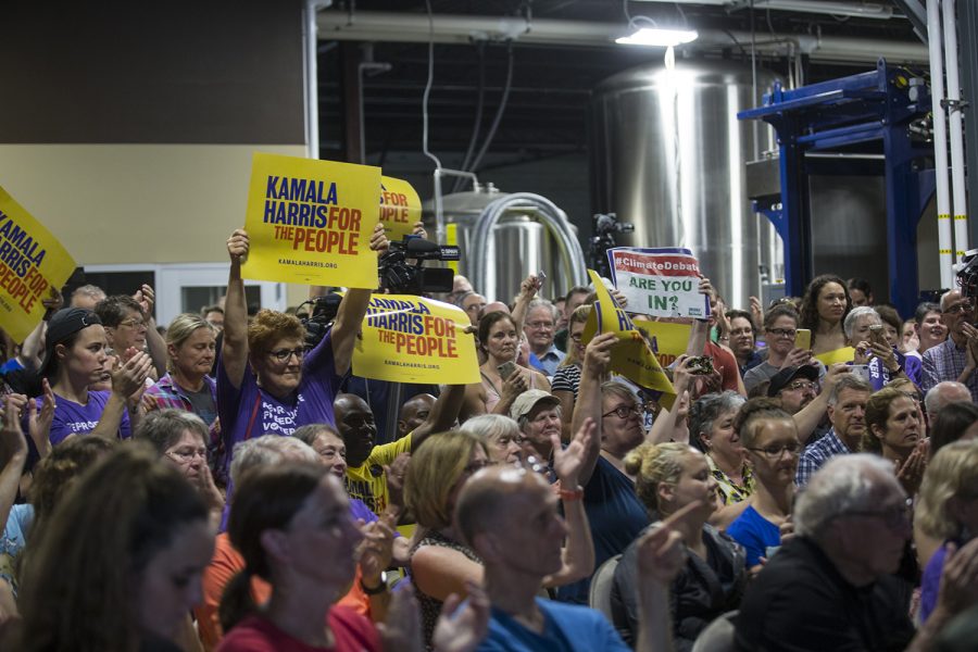 Supporters stand for Senator Kamala Harris as she enters for her town hall event at Confluence Brewery in Des Moines on July 3, 2019. (Katie Goodale/The Daily Iowan)