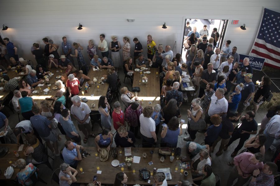 People gather during a brunch fundraiser for Sen. Zach Wahls at the Walker Homestead on July 14, 2019. 
