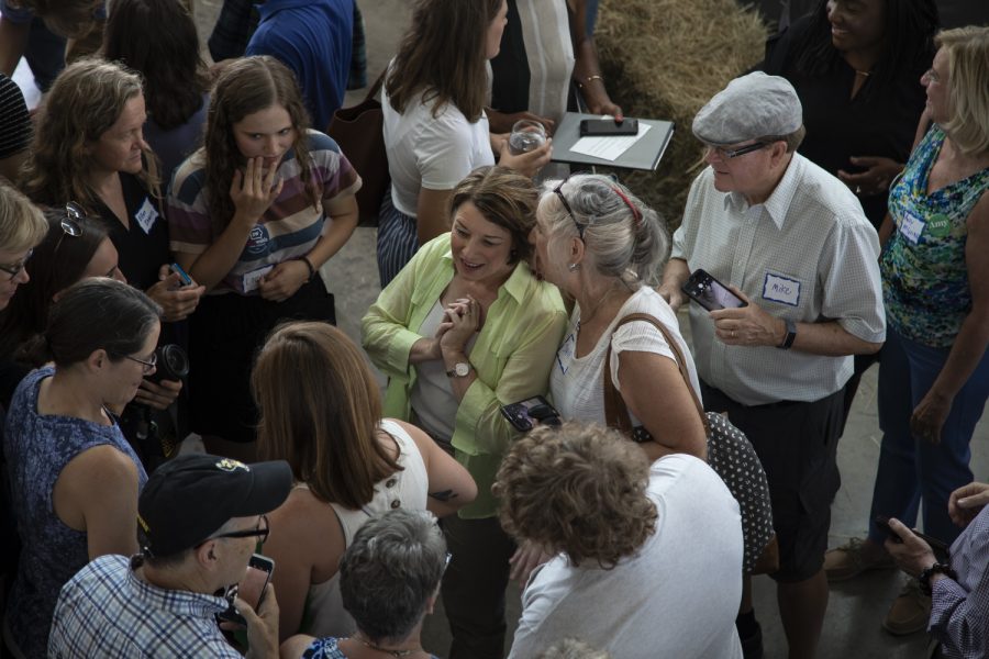 U.S Senator Amy Klobuchar talks with voters during a brunch fundraiser for Zach Wahls at the Walker Homestead on Sunday, July 14, 2019. (Tian Liu/The Daily Iowan)