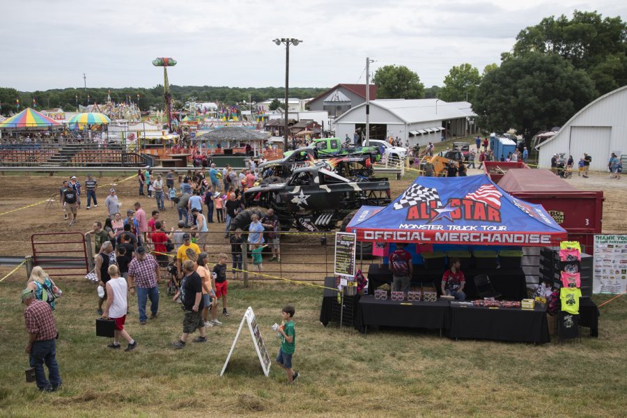 Fans gather to meet monster truck drivers during the first-evert All-Star Monster Trucks show at the Johnson County Fair on July 21, 2019.