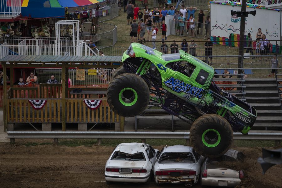 Against the Grain jumps over the cars during the first-evert All-Star Monster Trucks show at the Johnson County Fair on July 21, 2019.