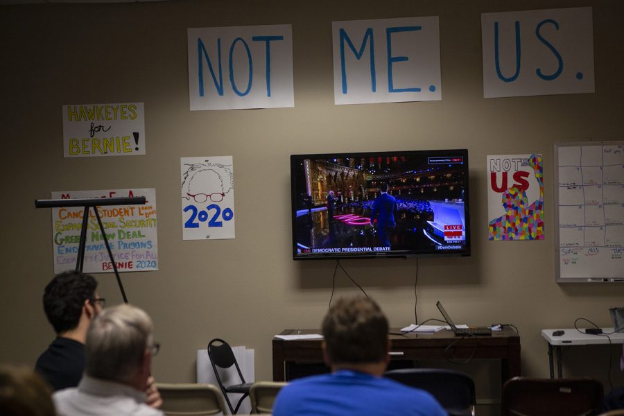 Supporters of Senator Bernie Sanders, D-VT, watch the debates from his campaign office in Iowa City on July 30, 2019. (Katie Goodale/The Daily Iowan)