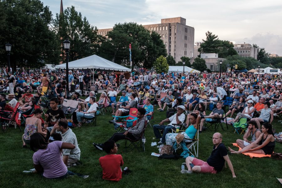 The audience watches a performance during the 2019 Iowa City Jazz Festival in downtown Iowa City on Friday, July 5, 2019.  Jazz Fest is a three day extravaganza with stages on Iowa Avenue, Clinton Street, and the Pentacrest. The last performance will commence at 9 p.m. on Sunday.