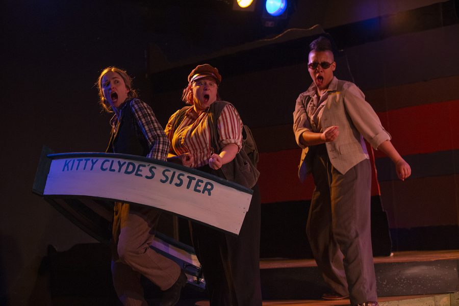 Bradley (Lauren Galliart), Old Shady (Karle Meyers), and Seneca (Jo Jordan) navigate rough waters aboard the Kitty Clyde’s Sister during the final dress rehearsal of Men on Boats on Wednesday, July 3, 2019 at the Riverside Theatre. (Emily Wangen/The Daily Iowan)