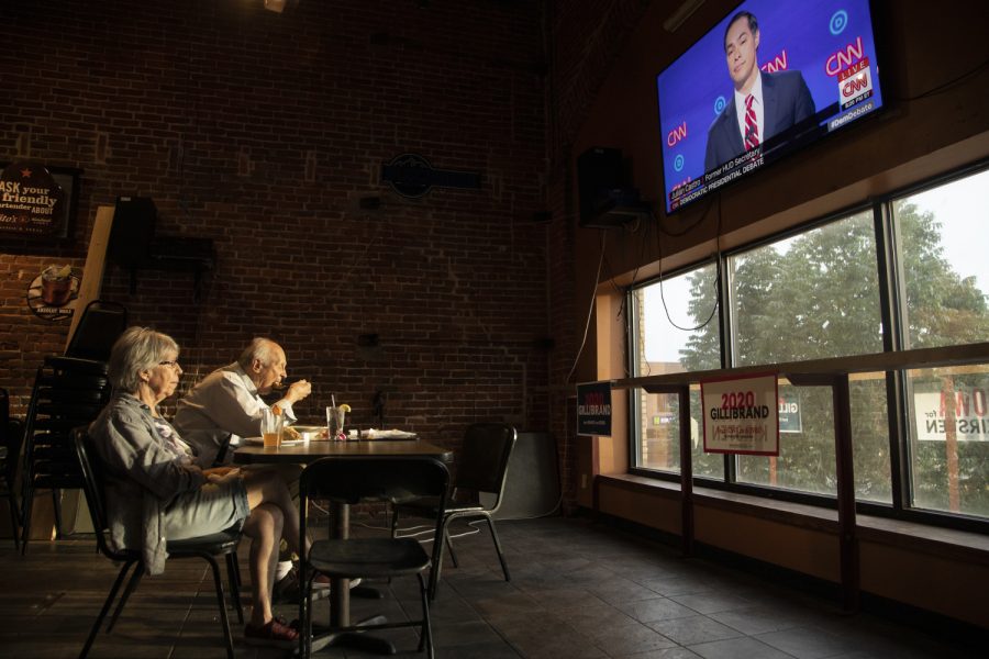 Nicholas Johnson and Mary Vasey of Iowa City watch the debate at Airliner for Sen. Kirsten Gillibrand on July 31, 2019. This is the second night of the second round of debates for democratic candidates. (Ryan Adams/The Daily Iowan)