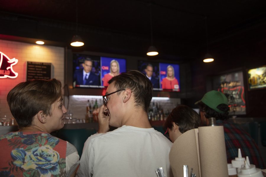 Attendees converse during a debate watch party for Sen. Cory Booker at Mosleys on July 31, 2019. This is the second night of the second round of debates for democratic candidates. (Ryan Adams/The Daily Iowan)