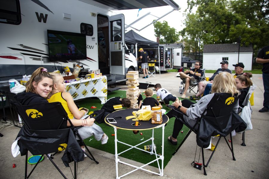 A group of Hawkeye fans enjoying a barbecue and playing games off of Melrose Avenue. Tailgate gatherings are set up all along Melrose Avenue before the Hawkeye vs. Miami University on August 31, 2019.