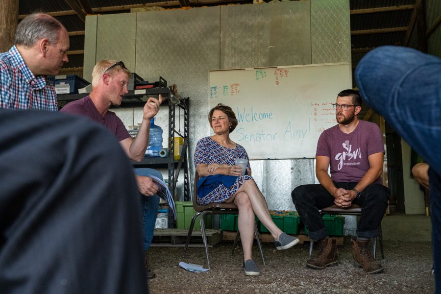 Sen. Amy Klobuchar, D-Minn., speaks to local farmers during a tour of the Johnson County Historic Poor Farm in Iowa City on Thursday, August 8, 2019.