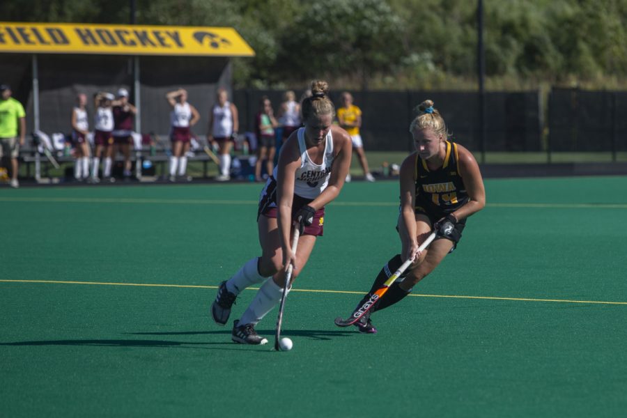Iowa forward Ryley Miller runs next to a Central Michigan player during a field hockey game between Iowa and Central Michigan at Grant Field on Friday, September 6, 2019. The Hawkeyes defeated the Chippewas, 11-0.