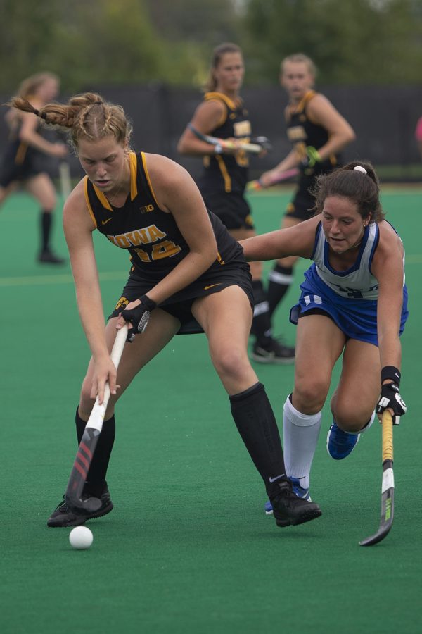 Iowa defender Lokke Stribos shields the ball during a field hockey game between Iowa and Duke at Grant Field on Sunday, September 15, 2019. The Hawkeyes were defeated by the Blue Devils, 2-1 after two overtime periods.