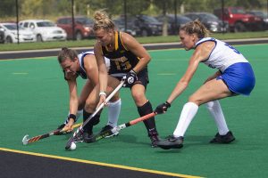 Iowa forward Leah Zellner tries to shield the ball from two Duke players during a field hockey game at Grant Field on Sunday, September 15, 2019. The Hawkeyes were defeated by the Blue Devils, 2-1 after two overtime periods.