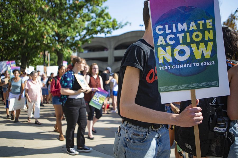 Climate strikers march from City Hall to the Pentacrest to raise awareness about the threat of climate change. The march was one of hundreds taking place around the world on Friday, Sept. 20. (Reba Zatz/The Daily Iowan)