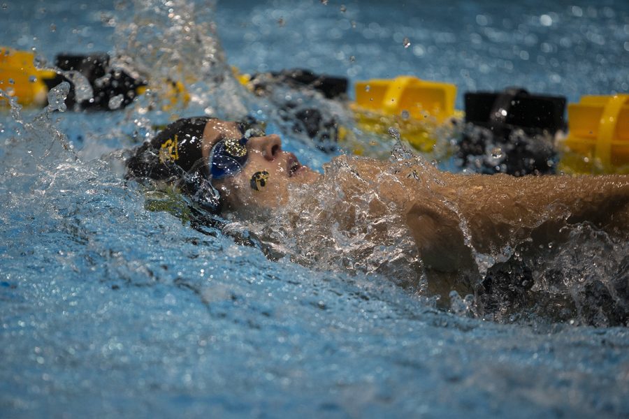 Helen Blumenau competes in the Women’s 100 backstroke during an intrasquad meet at the Campus Recreation and Wellness Center on Saturday Sept. 28, 2019. The Gold team defeated the Black team 109.0-83.0. Blumenau placed fifth with a time of 1:01.53. (Katie Goodale/The Daily Iowan)