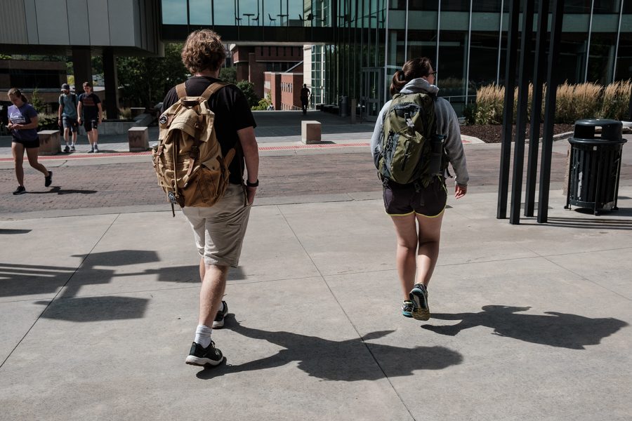 Cathryn and her husband Dylan walk through the University of Iowa campus on Tuesday, September 10, 2019. Cathryn is a senior graduate student and her husband is an artist. 