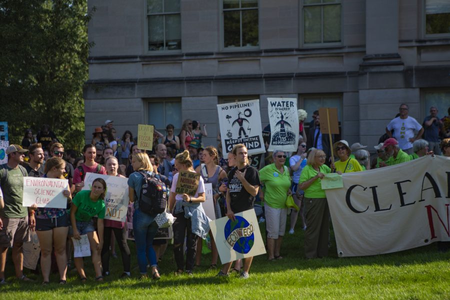 A crowd of hundreds gathers on the Pentacrest lawn to raise awareness about climate change. The Iowa City Climate Strike march was one of hundreds taking place around the world on Friday, Sept. 20.