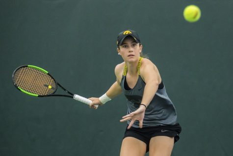 Iowas Elise Van Heuvelen Treadwell hits a forehand during a womens tennis match between Iowa and Maryland at the HTRC on Sunday, April 7, 2019. The Hawkeyes defeated the Terrapins, 6-1. 