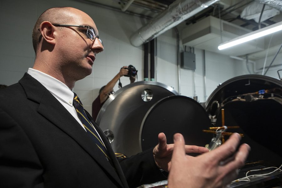 Assistant Professor of Physics and Astronomy David Miles presents the thermal-vacuum chamber used for testing equipment for spaceflight during a visit to the University of Iowa by NASA Administrator Jim Bridenstine on August 30, 2019. The University of Iowa recently received a $115 million grant to launch the TRACERS mission, which will collect data on the interaction of the earth and sun’s magnetic fields. (Ryan Adams/The Daily Iowan)