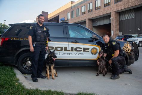 Officer Mohling (from left) K9 Brad, K9 Hogan and Officer Monter pose for a portrait on Tuesday, September 3, 2019.