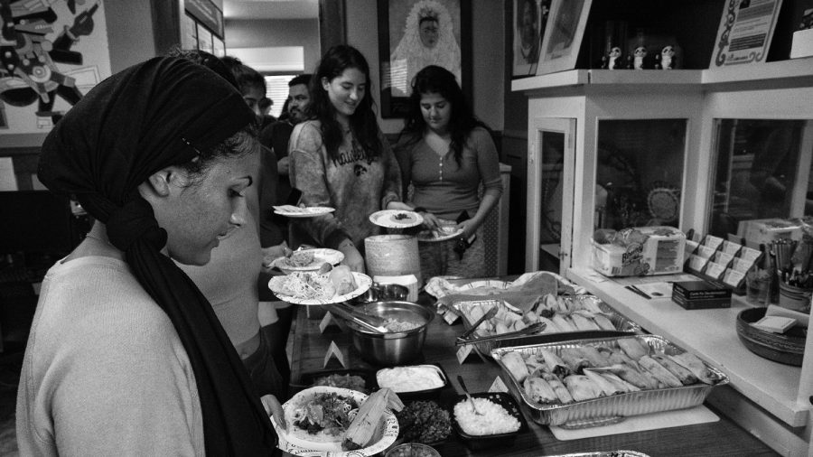 A group of students line at the buffet as part of the Latinx Heritage Kickoff celebration on Sunday, September 15th, 2019. The Latino Native American Cultural Center is putting on multiple new events that span across different departments at the UI for graduate and undergraduate students. 