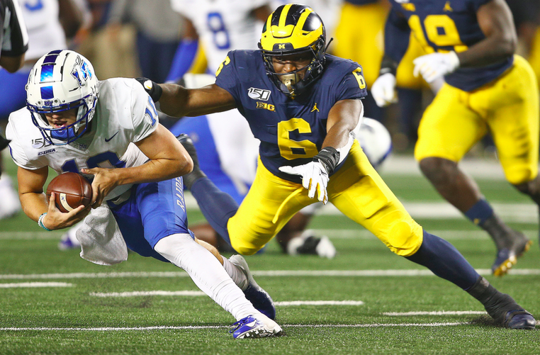 Michigan linebacker Josh Uche (6) sacks Middle Tennessee quarterback Asher O'Hara (10) during their college football game at Michigan Stadium in Ann Arbor, on Saturday, August 31, 2019. Michigan won the game, 40-21. (Mike Mulholland/MLive.com/TNS)