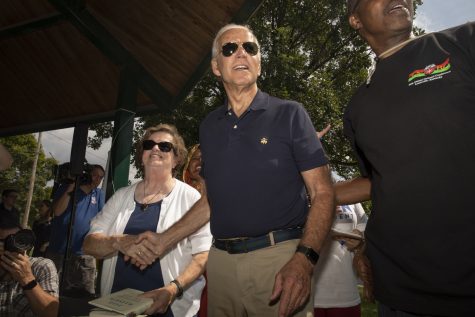 Former Vice President Joe Biden shakes the hand of an attendee while moving towards his campaign tent during the Iowa City Federation of Labor Labor Day Picnic in City Park on September 2, 2019. Among the candidates to attend the event were Sen. Michael Bennet and Former Vice President Joe Biden. (Ryan Adams/ The Daily Iowan)