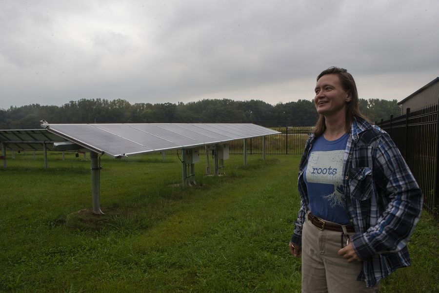 Jean Wiedenheft explains net solar energy among some of the solar panels at the Indian Creek Nature Center in Cedar Rapids on Thursday, September 19, 2019. Jean explained that although the building does not run on solar power all day every day, “we give more to the grid than we take back from it.” The center recently received recognition as a Petal Certified Building under the Living Building Challenge. 