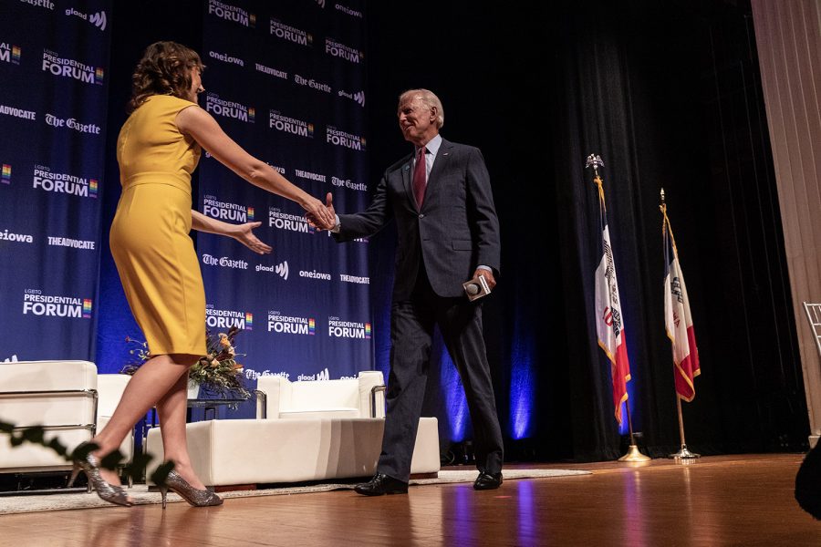 Former Vice President Joe Biden shakes the hand of moderator Lyz Lenz at the LGBTQ forum Friday Sept. 20