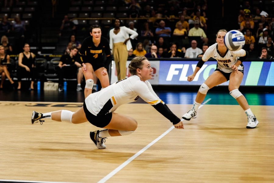 Iowa defensive specialist Joslyn Boyer dives for the ball during a volleyball match between Iowa and Washington at Carver Hawkeye Arena on Saturday, September 7, 2019. The Hawkeyes were defeated by the Huskies, 3-1.
