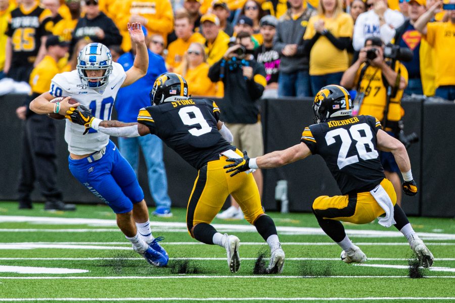 MTSU+quarterback+Asher+OHara+escapes+Iowas+Geno+Stone+during+a+football+game+between+Iowa+and+Middle+Tennessee+State+at+Kinnick+Stadium+on+Saturday%2C+September+28%2C+2019.+The+Hawkeyes+defeated+the+Blue+Raiders%2C+48-3.