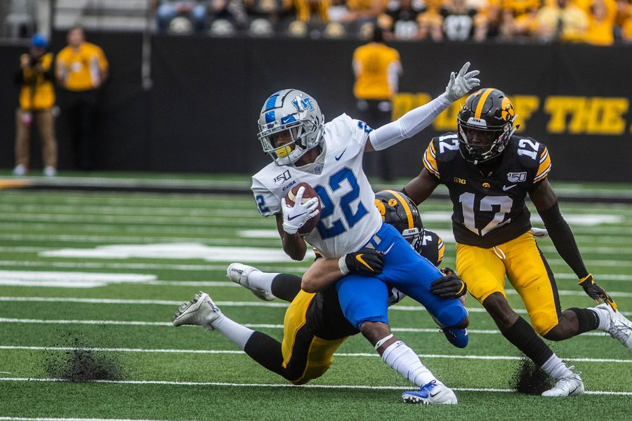 Iowa+linebacker+Seth+Benson+tackles+MTSU+wide+receiver+DJ+England+Middle+Chisolm+during+a+football+game+between+Iowa+and+Middle+Tennessee+State+University+on+Saturday%2C+September+28%2C+2019.+The+Hawkeyes+defeated+the+Blue+Raiders+48-3.