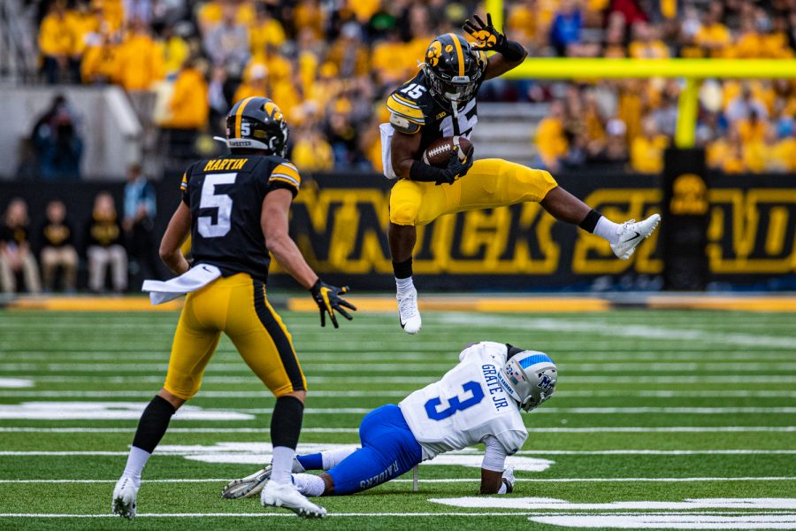Iowa running back Tyler Goodson hurdles MTSUs Gregory Grate, Jr. during a football game between Iowa and Middle Tennessee State at Kinnick Stadium on Saturday, September 28, 2019. The Hawkeyes defeated the Blue Raiders, 48-3.