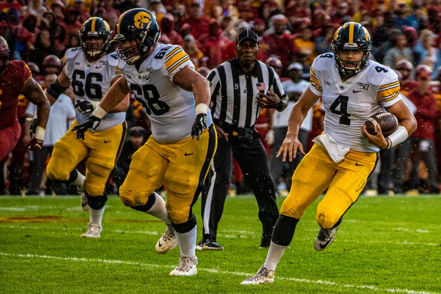 Iowa quarterback Nate Stanley carries the ball during a football game between Iowa and Iowa State at Jack Trice Stadium in Ames on Saturday, September 14, 2019. 