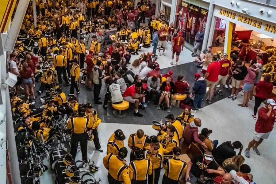 Marching+band+members+escape+the+rain+during+a+football+game+between+Iowa+and+Iowa+State+at+Jack+Trice+Stadium+in+Ames+on+Sept.+14%2C+2019.