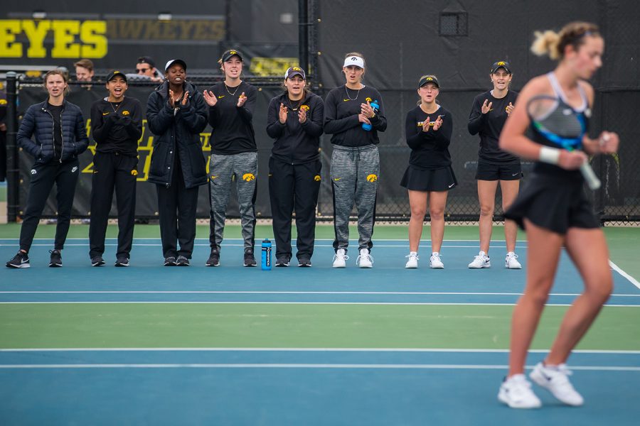 Iowa+players+cheer+on+Sophie+Clark+during+a+womens+tennis+match+between+Iowa+and+Rutgers+at+the+HTRC+on+Friday%2C+April+5%2C+2019.+The+Hawkeyes+defeated+the+Scarlet+Knights%2C+6-1.