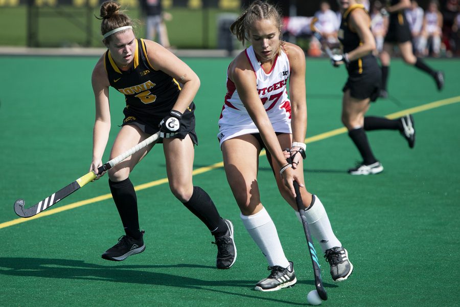Rutgers midfielder Milena Redlingshoefer attempts to keep the ball away from Iowa’s Meghan Conroy during the Iowa field hockey match against Rutgers on Friday, Oct. 4, 2019 at Grant Field. The Hawkeyes beat the Scarlet Knights 2-1. 