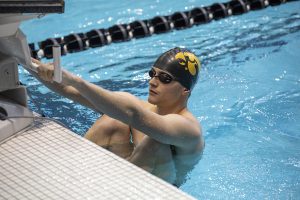A Hawkeye takes his mark for a backstroke event at the swim meet on Friday, October 4. The Iowa men won over Michigan State, 180 to 112. The Iowa women won over Michigan State 183 to 113. The women also won over Northern Iowa. 183 to 113. Michigan State won over Northern Iowa 180 to 120. 