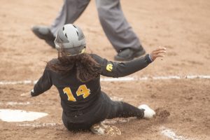 Iowa infielder Nia Carter slides to home plate at the Iowa softball game against Indian Hills at Pearl Field on Sunday, October 6th, 2019. The Hawkeyes defeated the Warriors 21-2.