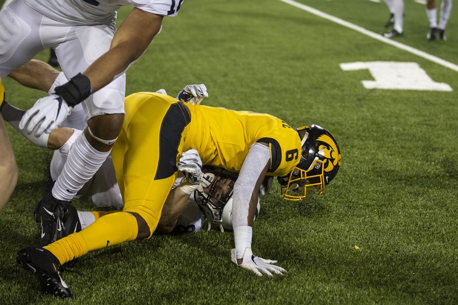 Iowa WR Ihmir Smith-Marsette is tackled during the Iowa football vs. Penn State game in Kinnick Stadium on Saturday, Oct. 12, 2019. The Nittany Lions defeated the Hawkeyes 17-12. 