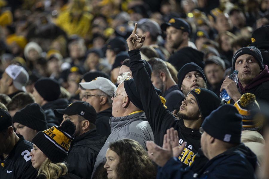 A Hawkeye fan give the middle finger to Penn State cheerleaders during the Iowa football vs. Penn State game in Kinnick Stadium on Saturday, Oct. 12, 2019. The Nittany Lions defeated the Hawkeyes 17-12. 