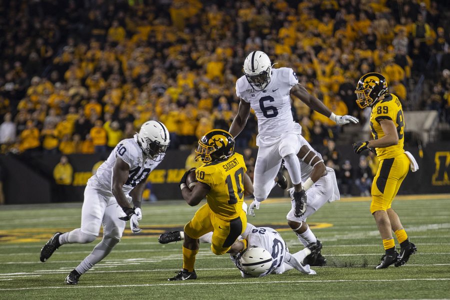 Iowa RB Mekhi Sargent is tackled during the Iowa football vs. Penn State game in Kinnick Stadium on Saturday, Oct. 12, 2019. The Nittany Lions defeated the Hawkeyes 17-12. 