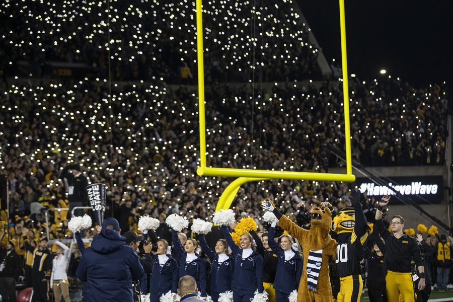 People participate in “The Wave” during the Iowa football vs. Penn State game in Kinnick Stadium on Saturday, Oct. 12, 2019. The Nittany Lions defeated the Hawkeyes 17-12. 