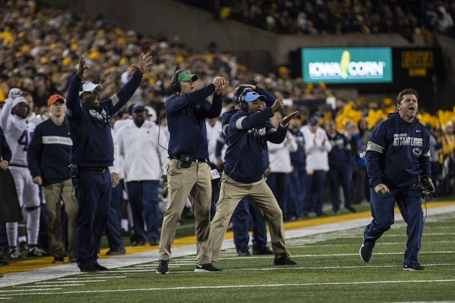 Penn State staff celebrates during the Iowa football vs. Penn State game in Kinnick Stadium on Saturday, Oct. 12, 2019. The Nittany Lions defeated the Hawkeyes 17-12. 