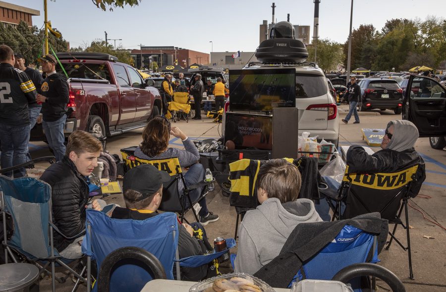 A group watches Iowa State play West Virginia during the tailgate before the Iowa-Penn State football game on October 12, 2019. The Hawkeyes are currently 4-1 after a loss to Michigan on the road last Saturday. (Ryan Adams/The Daily Iowan)