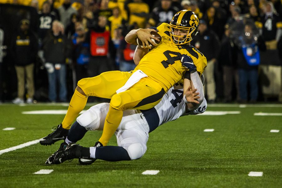 Iowa quarterback Nate Stanley is tackled during the Iowa football game against Penn State in Iowa City on Saturday, Oct. 12, 2019. The Nittany Lions defeated the Hawkeyes 17-12.