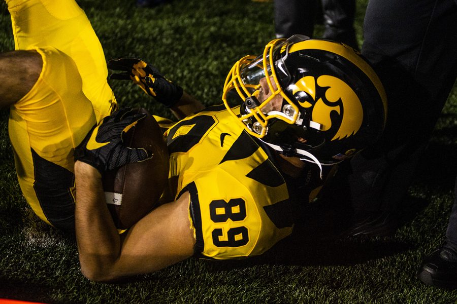Iowa wide receiver Nico Ragaini falls out of bound during the Iowa football game against Penn State in Iowa City on Saturday, Oct. 12, 2019. The Nittany Lions defeated the Hawkeyes 17-12.