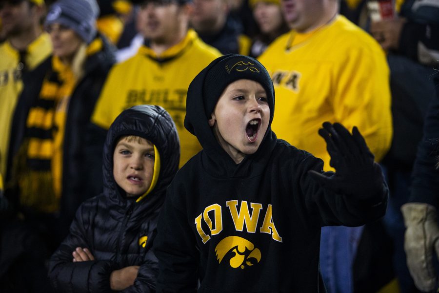 Young Iowa fans react to a call during the Iowa football game against Penn State in Iowa City on Saturday, Oct. 12, 2019. The Nittany Lions defeated the Hawkeyes 17-12.
