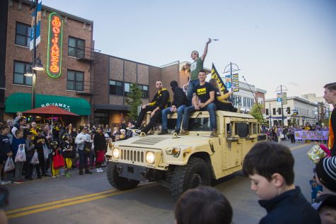 Members of Iowa Veterans ride a Jeep during the 2019 Homecoming Parade on Oct. 18 in Downtown Iowa City.