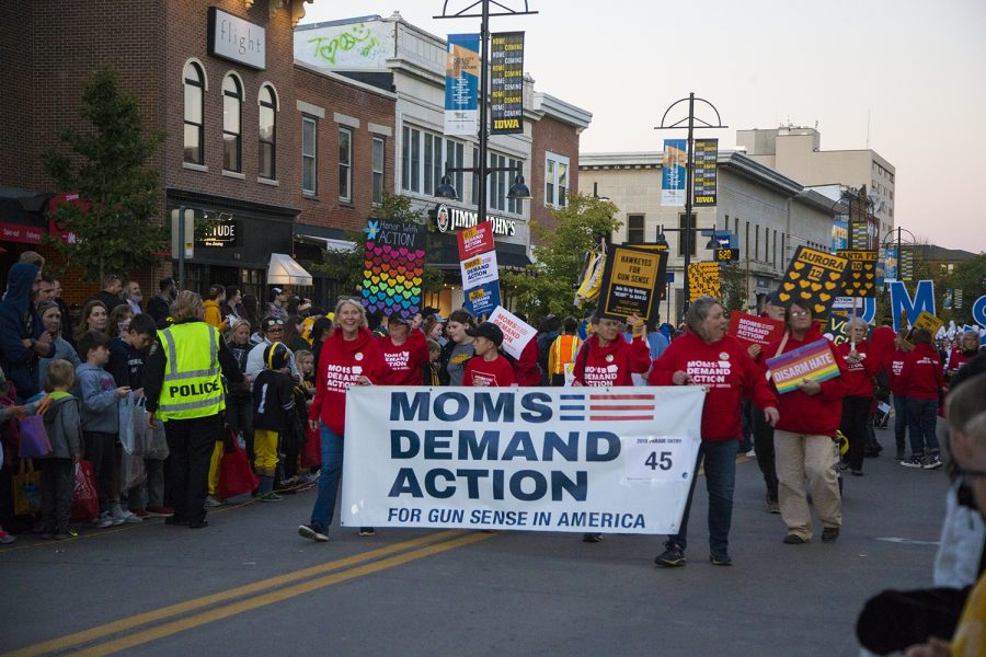 Members+of+Moms+Demand+Action+march+during+the+2019+Homecoming+Parade+on+Oct.+18+in+Downtown+Iowa+City.