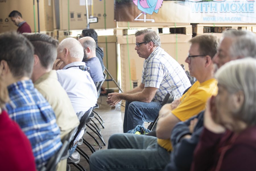 Attendees listen to 2020 Democratic Candidate and former Maryland Congressman John Delaney speak at Moxie Solar in North Liberty, IA, on Friday, Oct. 18, 2019. The visit was part of John Delaney’s Heartland Startup Tour. (Jenna Galligan/The Daily Iowan)