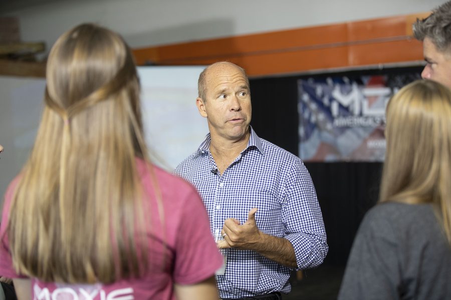 2020 Democratic Candidate and former Maryland Congressman John Delaney speaks to business owner Jason Hall and his family at Moxie Solar in North Liberty, IA, on Friday, Oct. 18, 2019. The visit was part of John Delaney’s Heartland Startup Tour. (Jenna Galligan/The Daily Iowan)